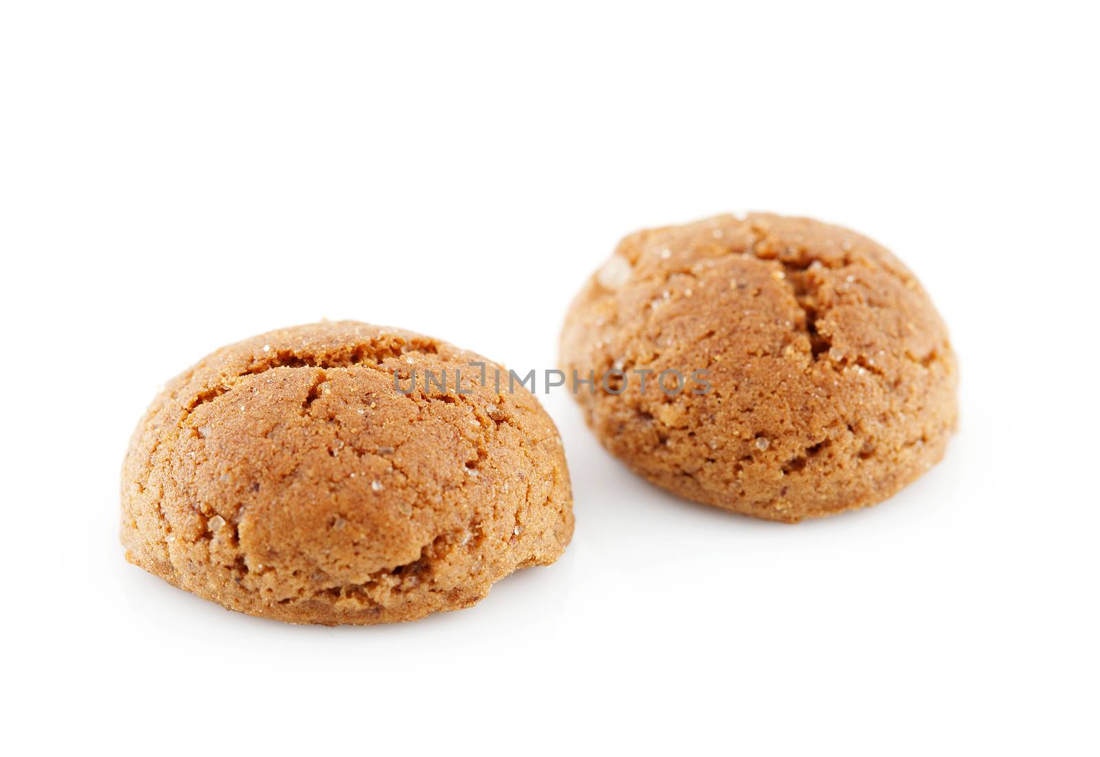Typical Dutch candy (pepernoten) in closeup over white background