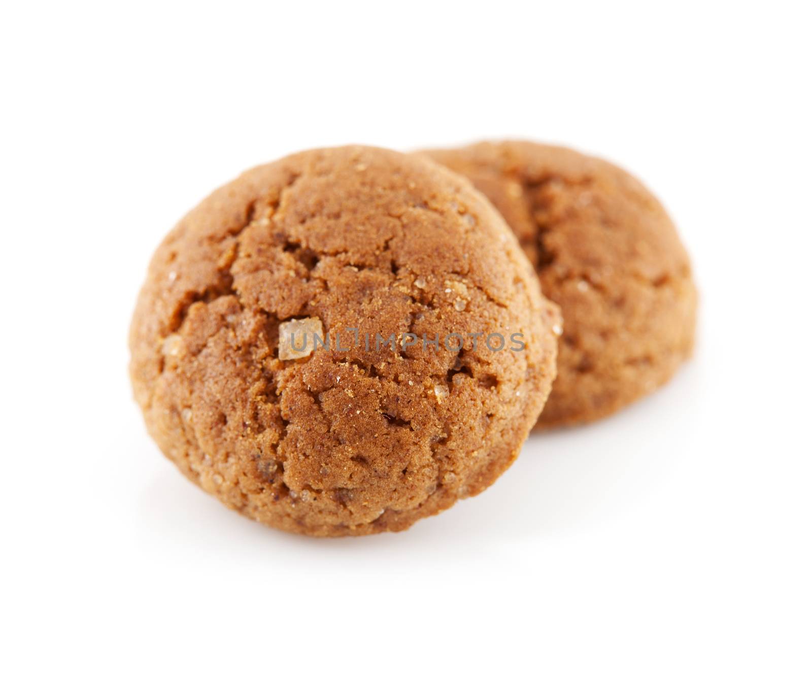 Typical Dutch candy (pepernoten) in closeup over white background