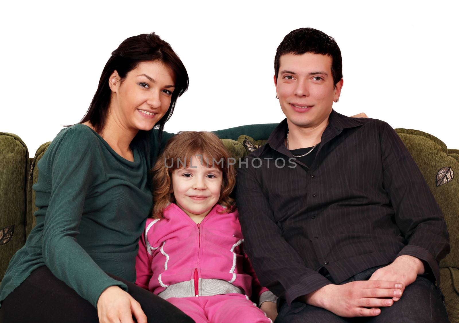 happy family sitting on couch by goce