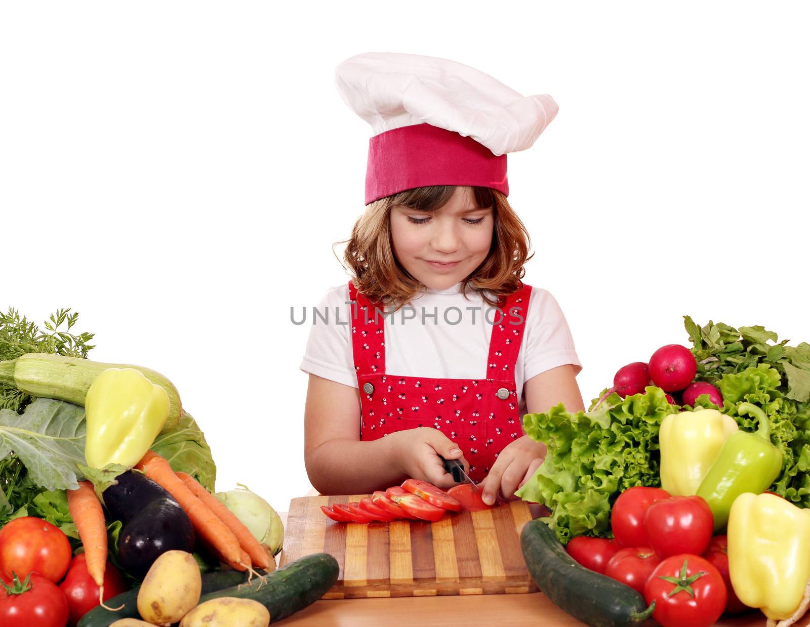 little girl cook cut tomatoes