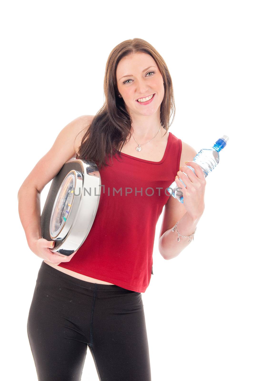 A girl with a weighing scale and a bottle of water