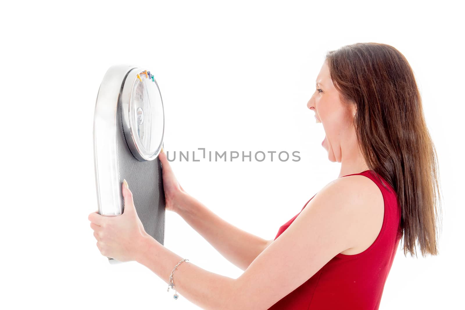 an angry girl with a weighing scale, on a white background