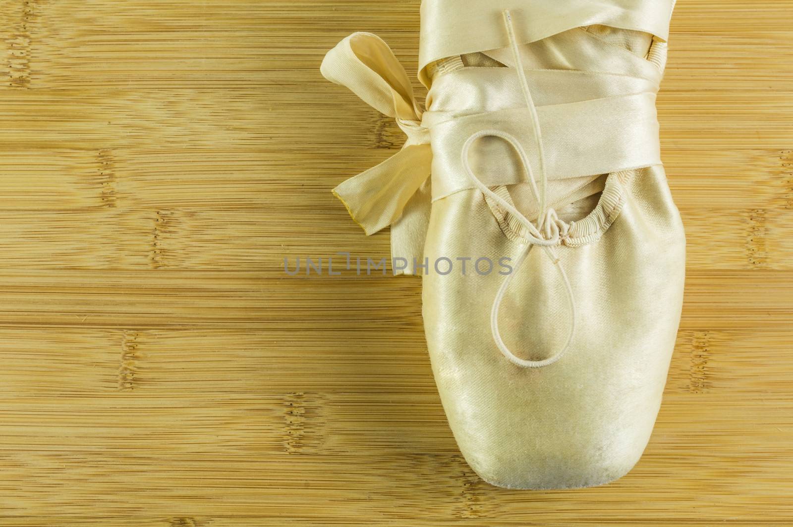 Ballet shoes on wooden flor by alexandrum01