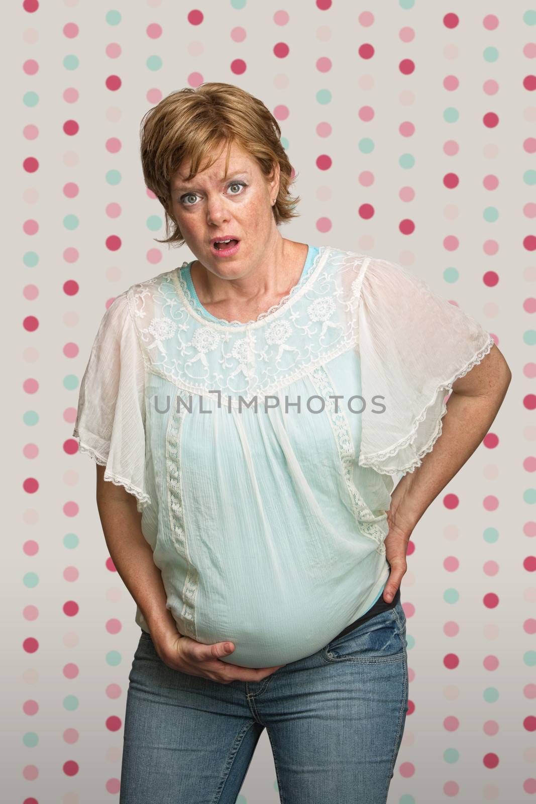 Single pretty young pregnant woman having contractions