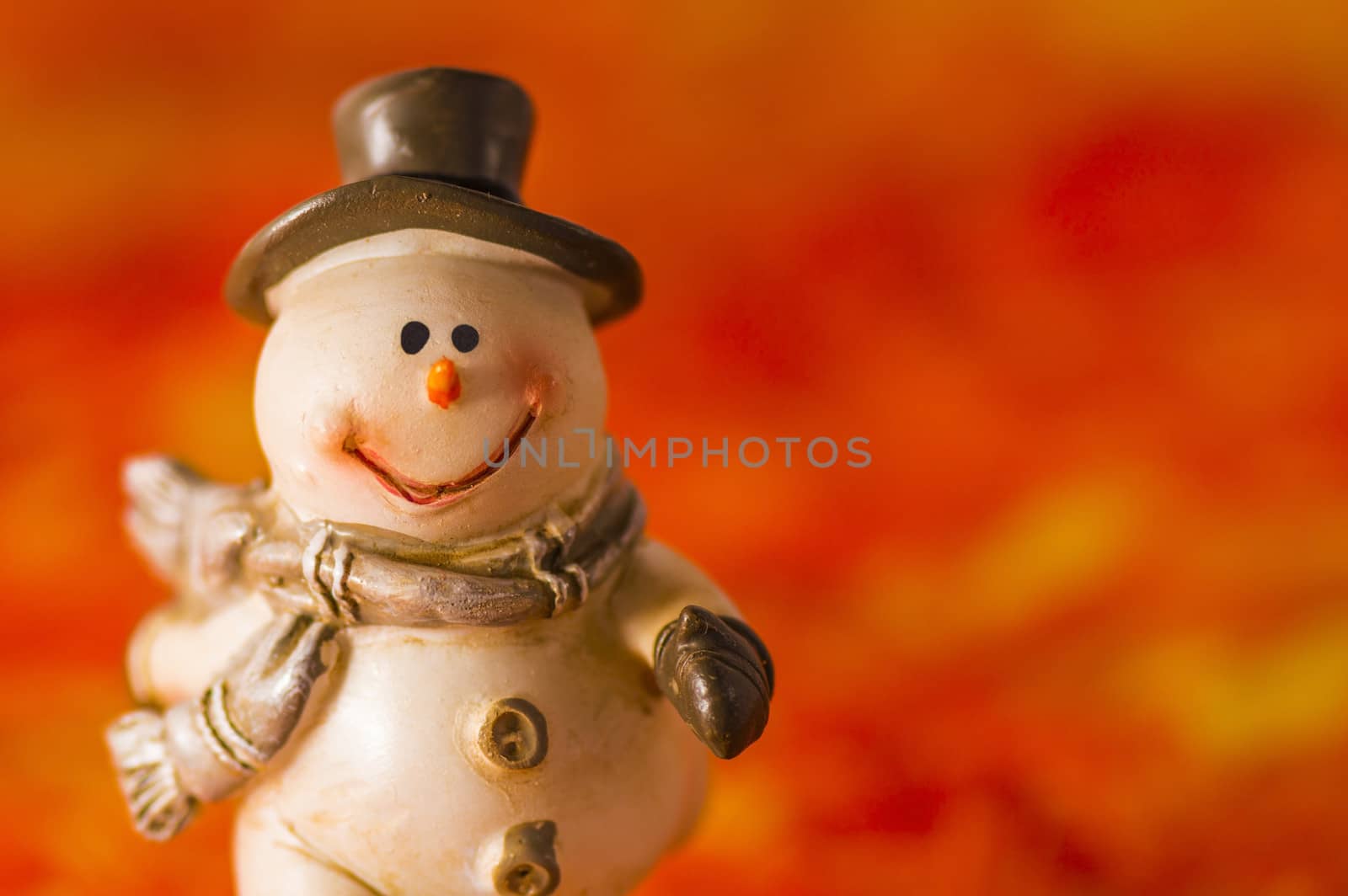 Happy snowman with hat and gloves on red background