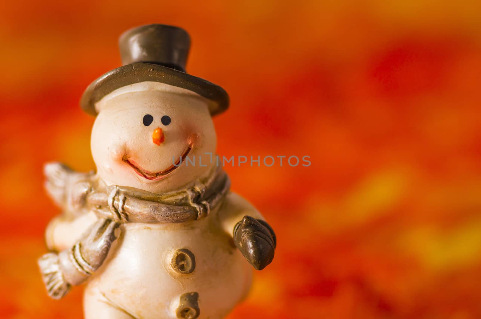 Happy snowman with hat and gloves on red background