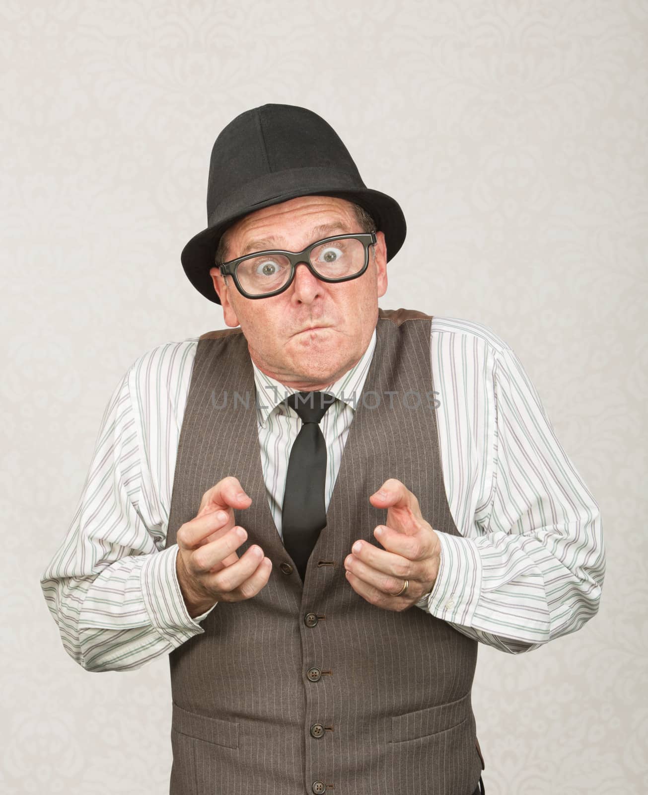 Single upset businessman with eyeglasses clenching fists