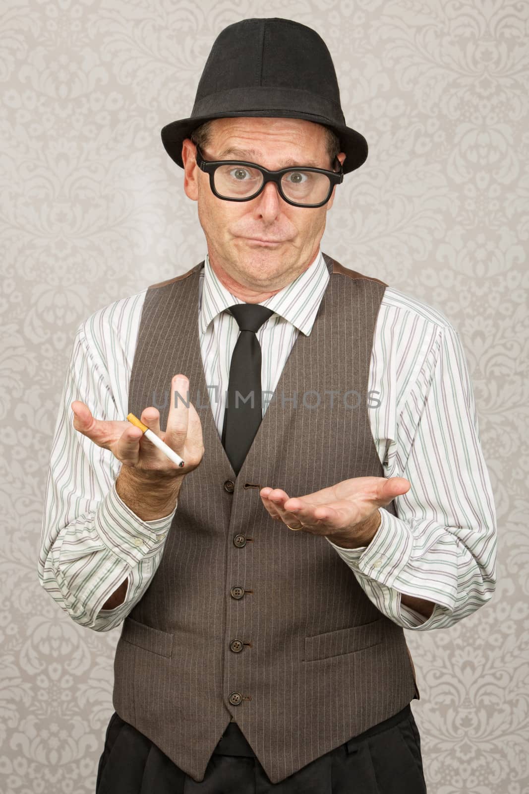 Indifferent European businessman with cigarette and open hands