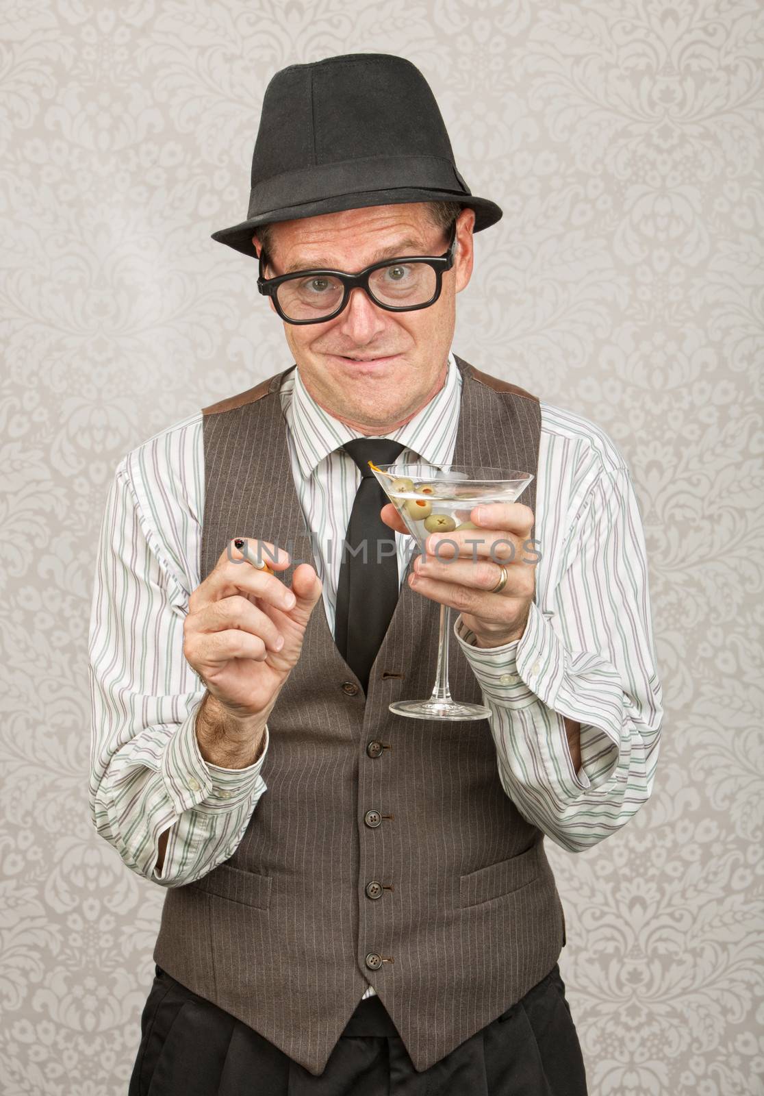 Awkward tipsy business man with cigarette and martini