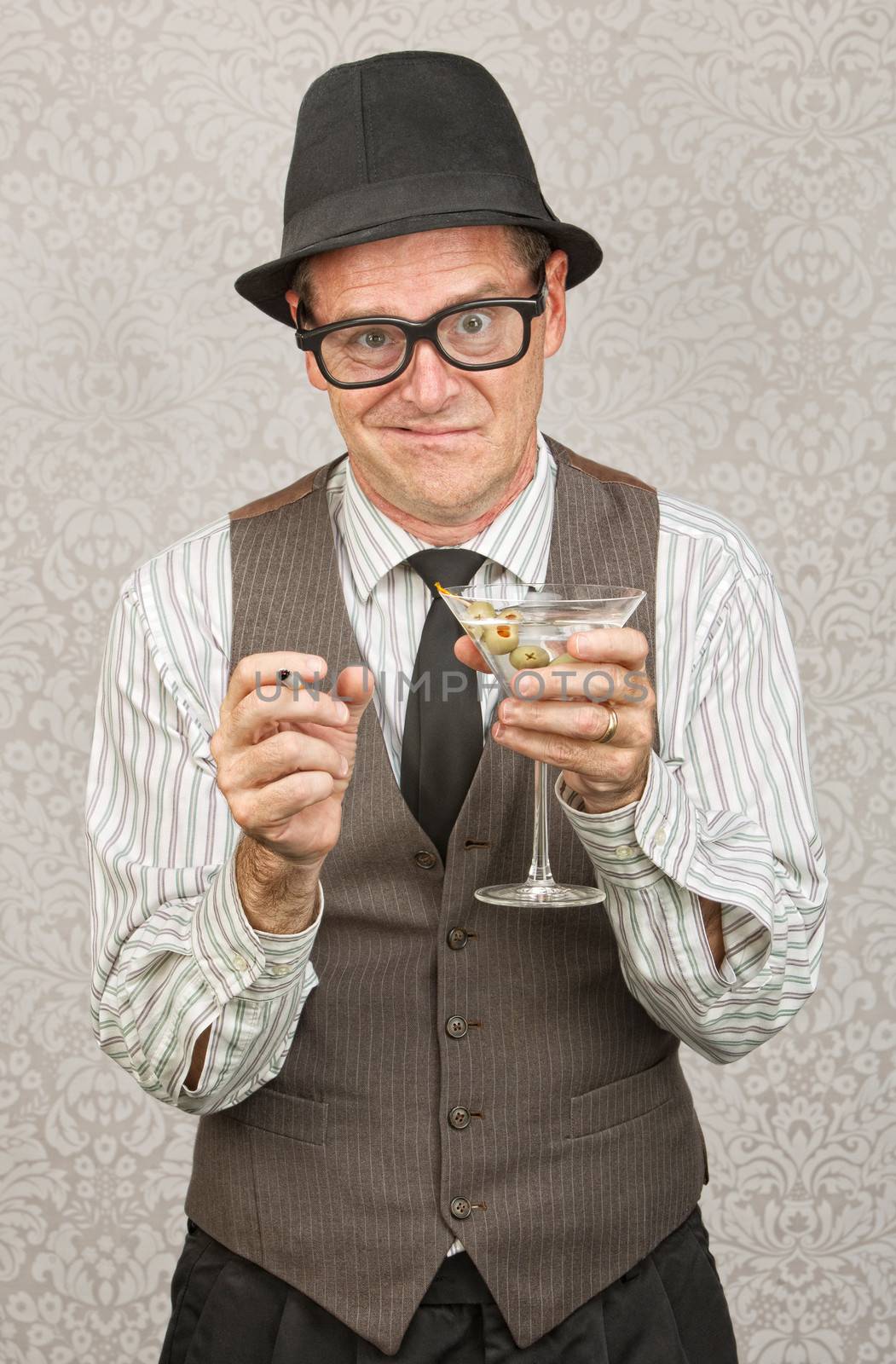 Drunk businessman holding martini and cigarette