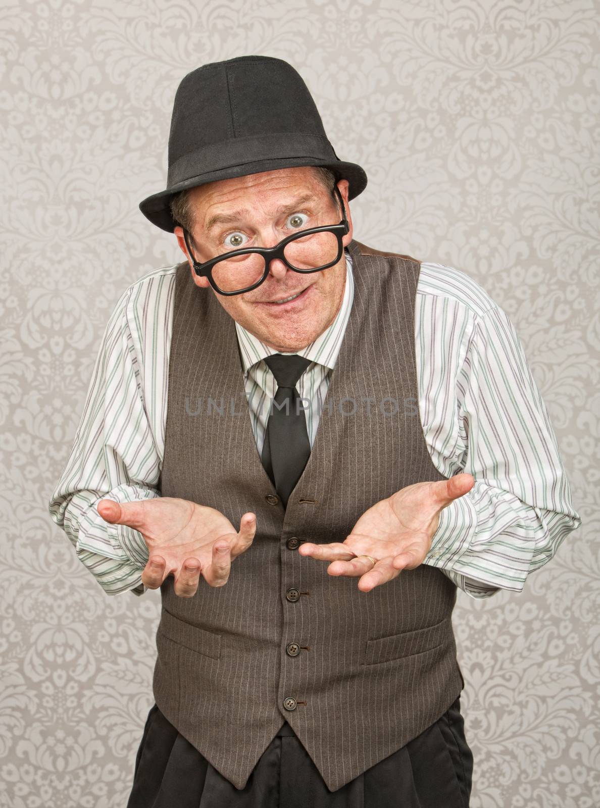 Single businessman in hat and eyeglasses with open hands