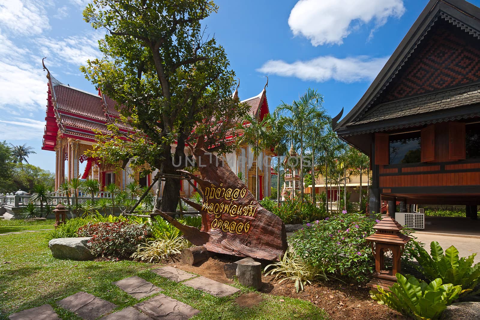 Beautiful park of  Buddhist temple on  background of blue sky, Thailand.