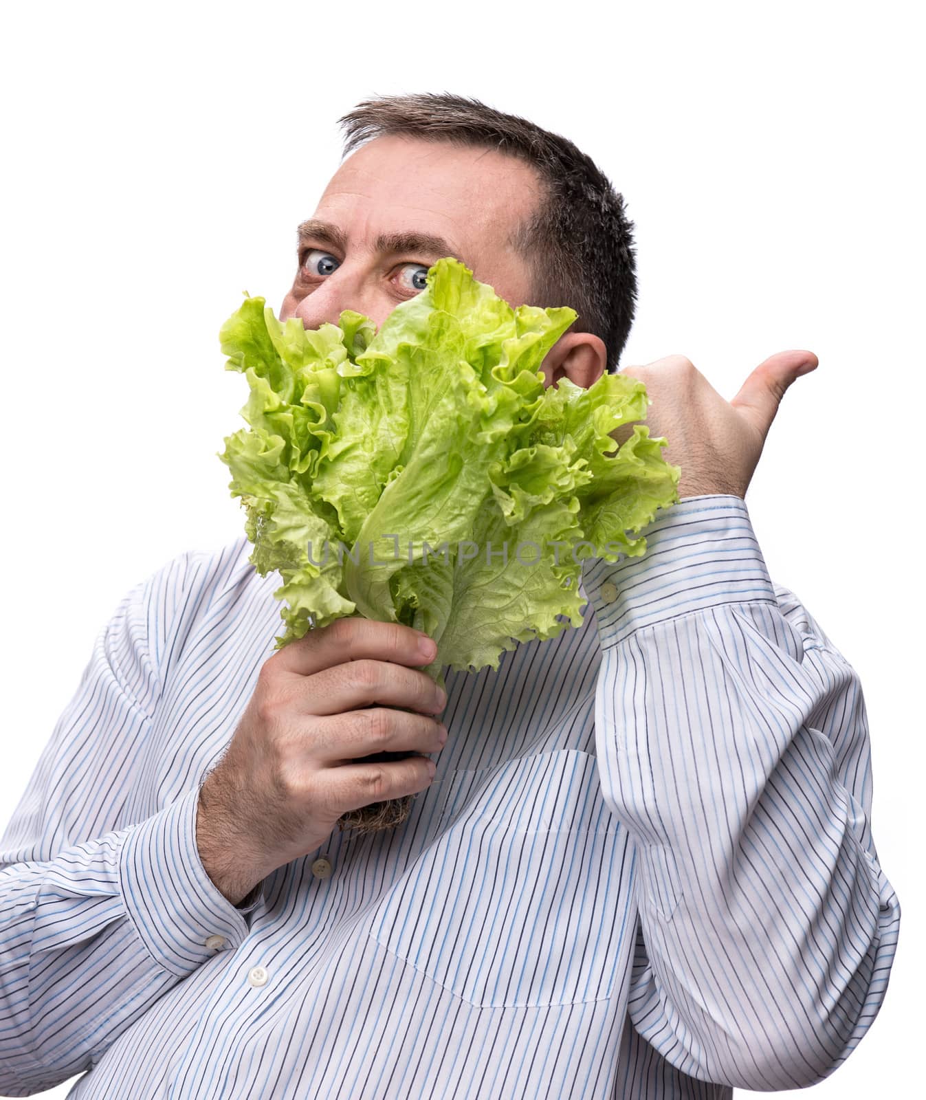 Healthy food. Man holding lettuce isolated on white