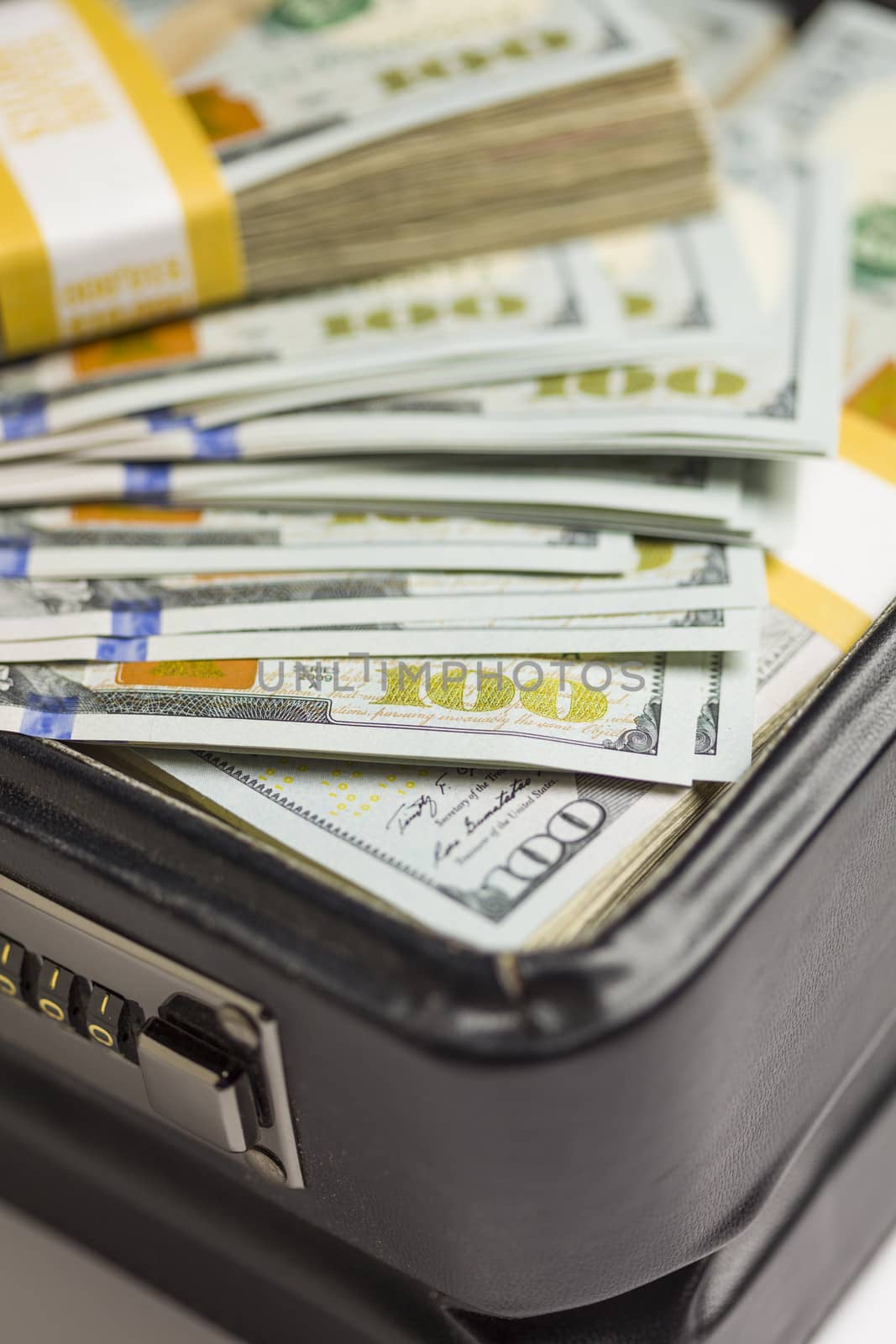 Abstract Stacks of Newly Designed U.S. One Hundred Dollar Bills in Briefcase.