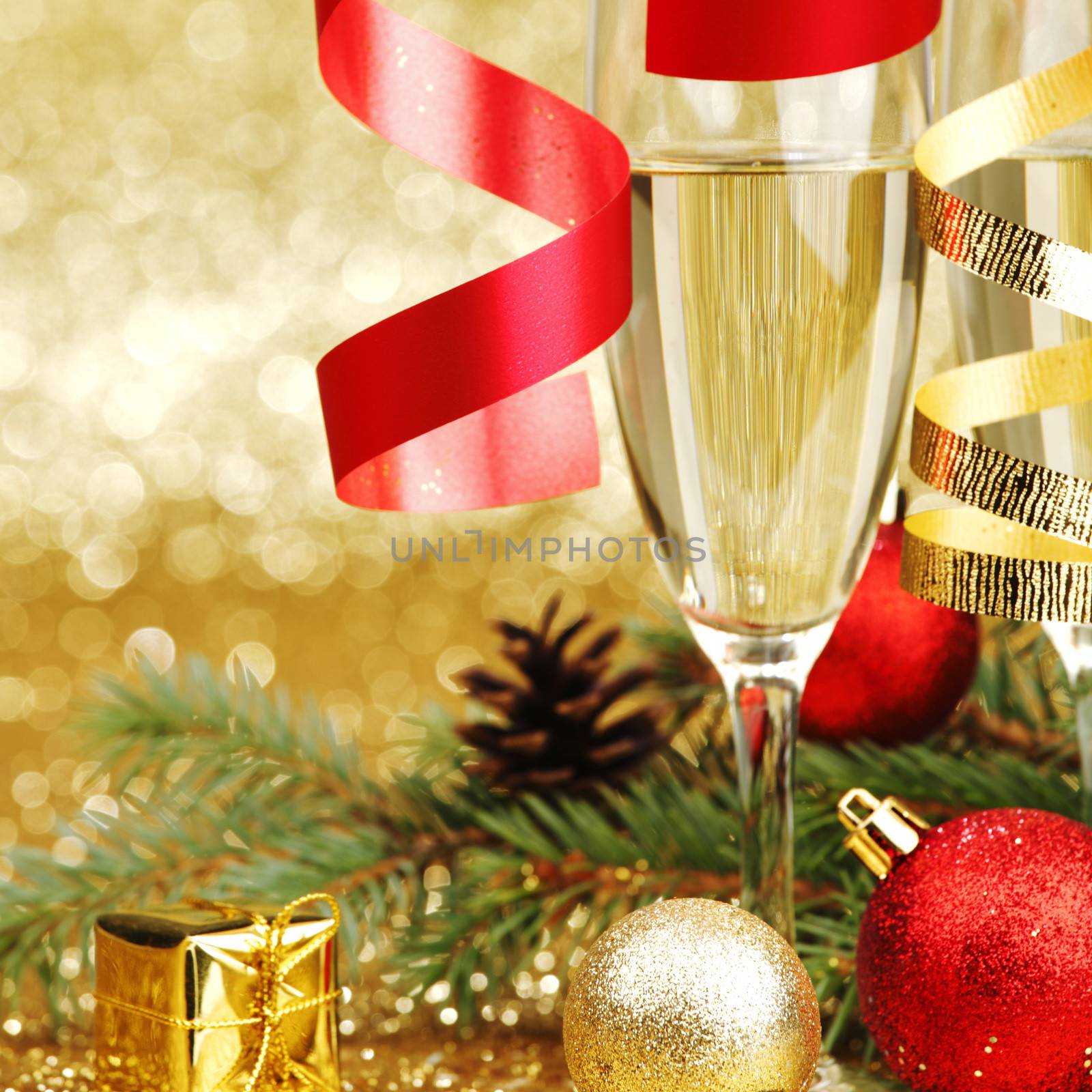 Champagne and new year decoration on golden background