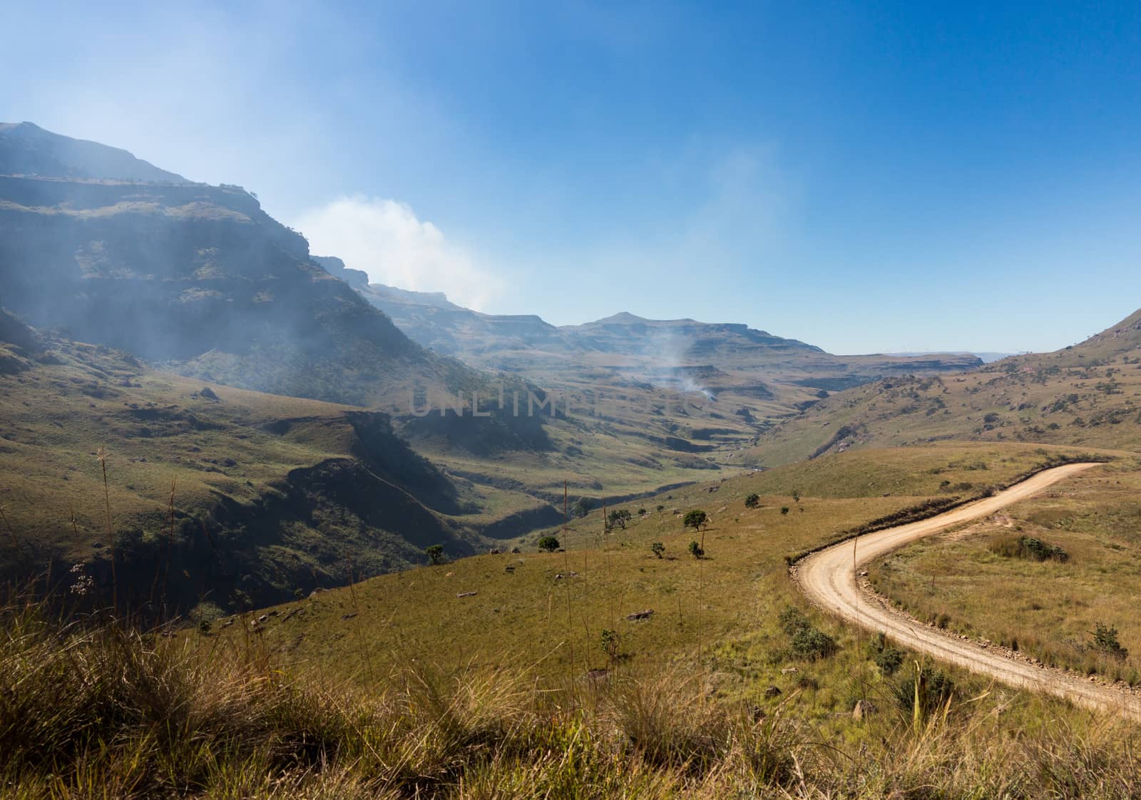 Valley and winding road over mountains from South Africa to Lesotho over Sani Pass