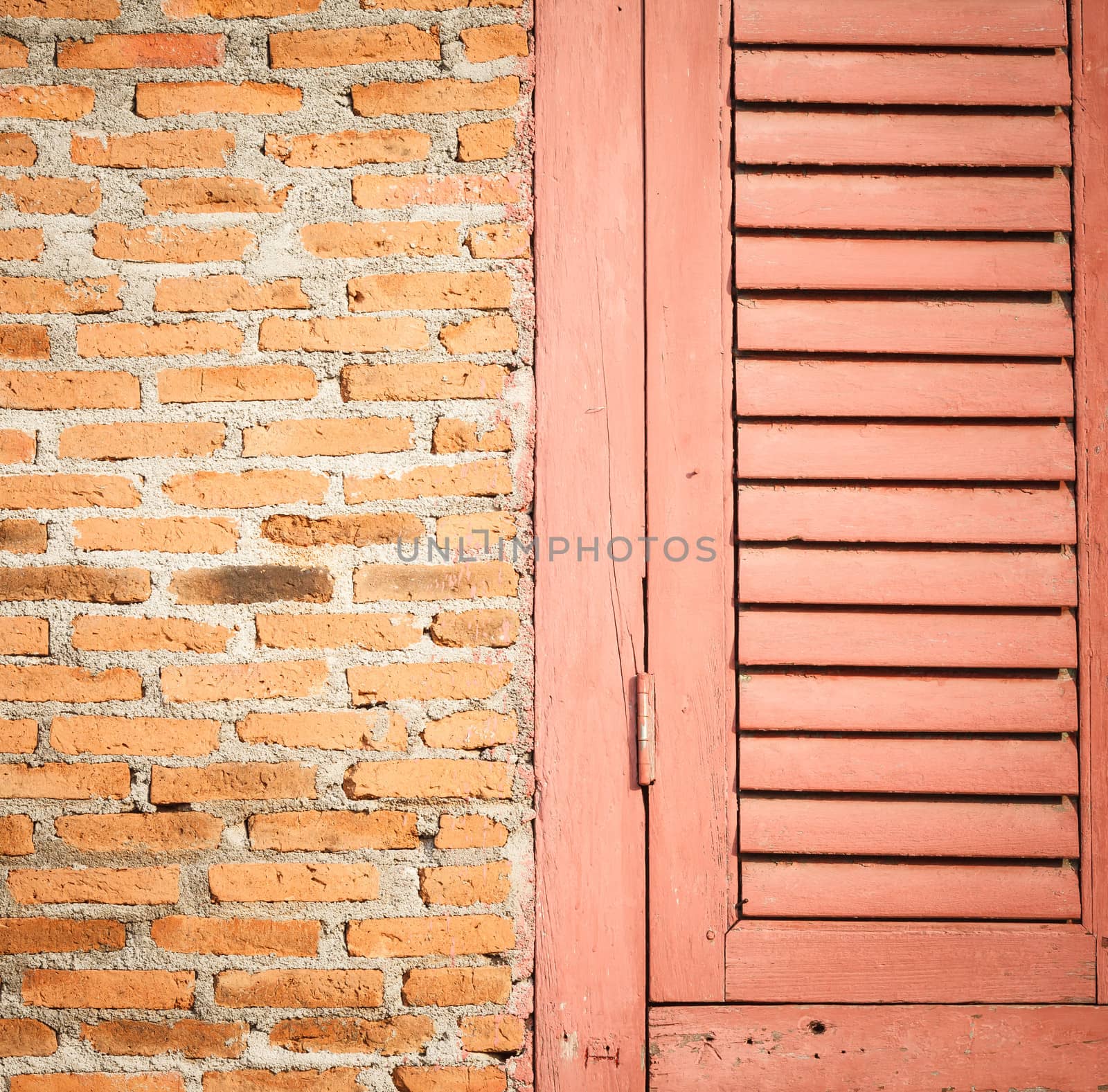 Close up wooden door and brick wall