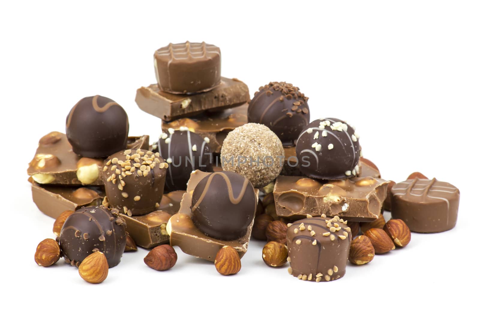 chocolate and nuts on white background