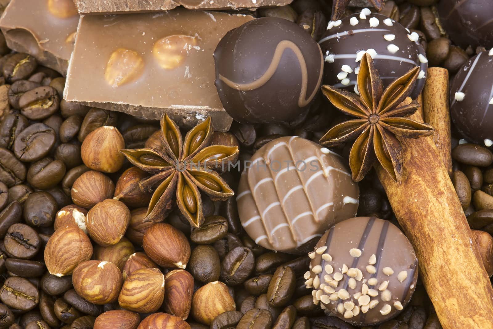 background with chocolate, coffee, spices and nuts 