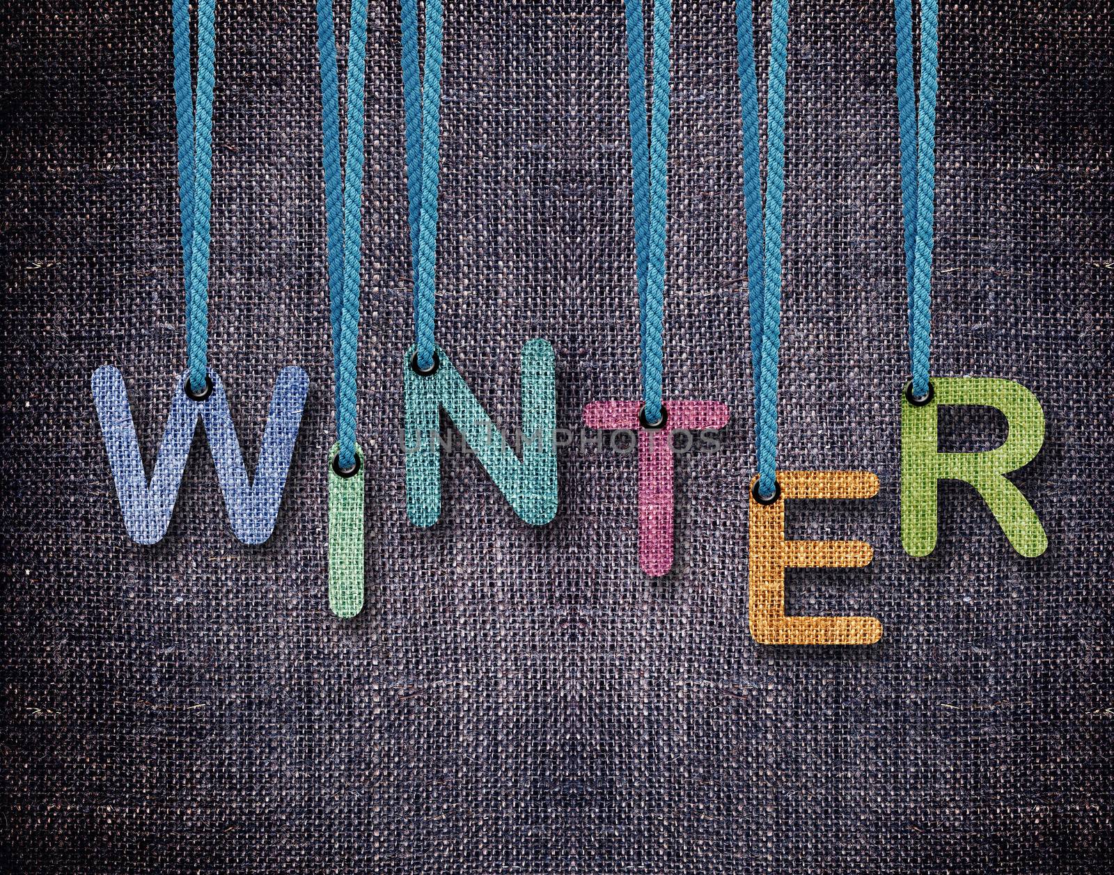Winter letters hanging strings with blue sackcloth background.