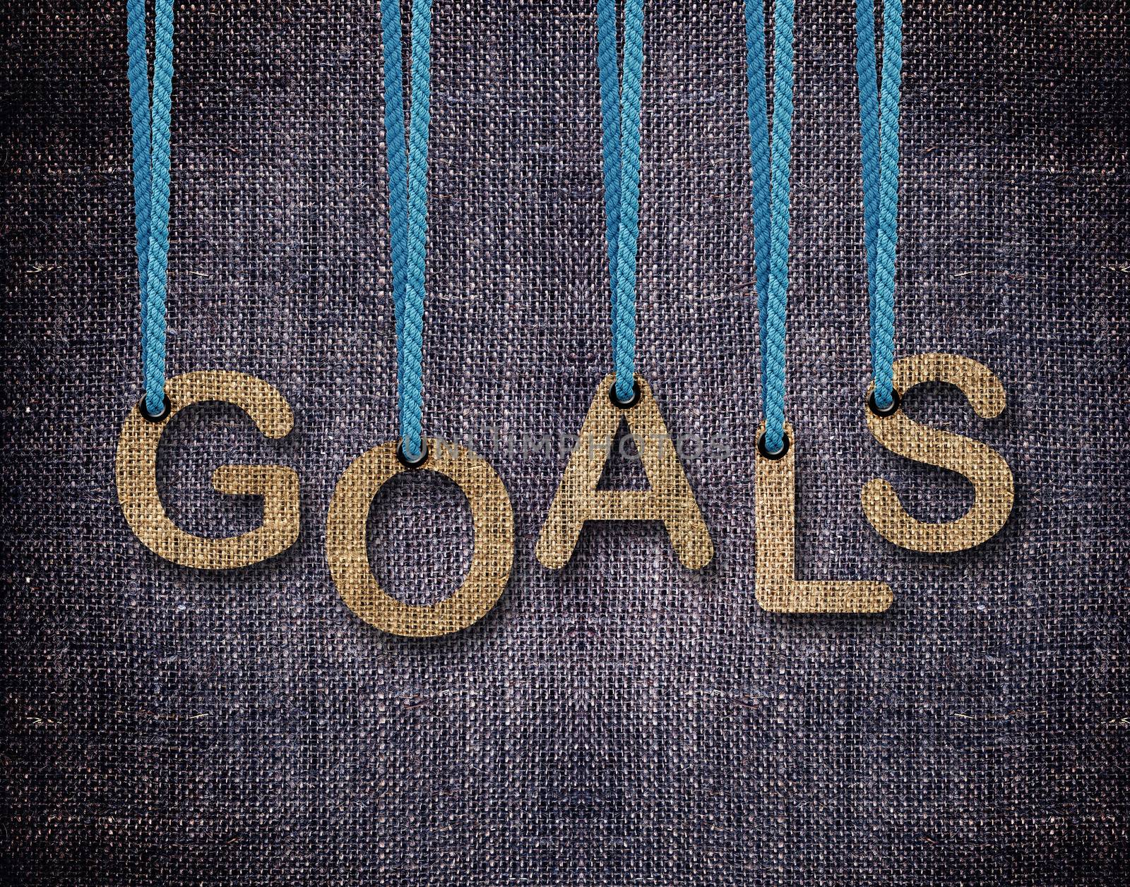 Goals Letters hanging strings with blue sackcloth background.