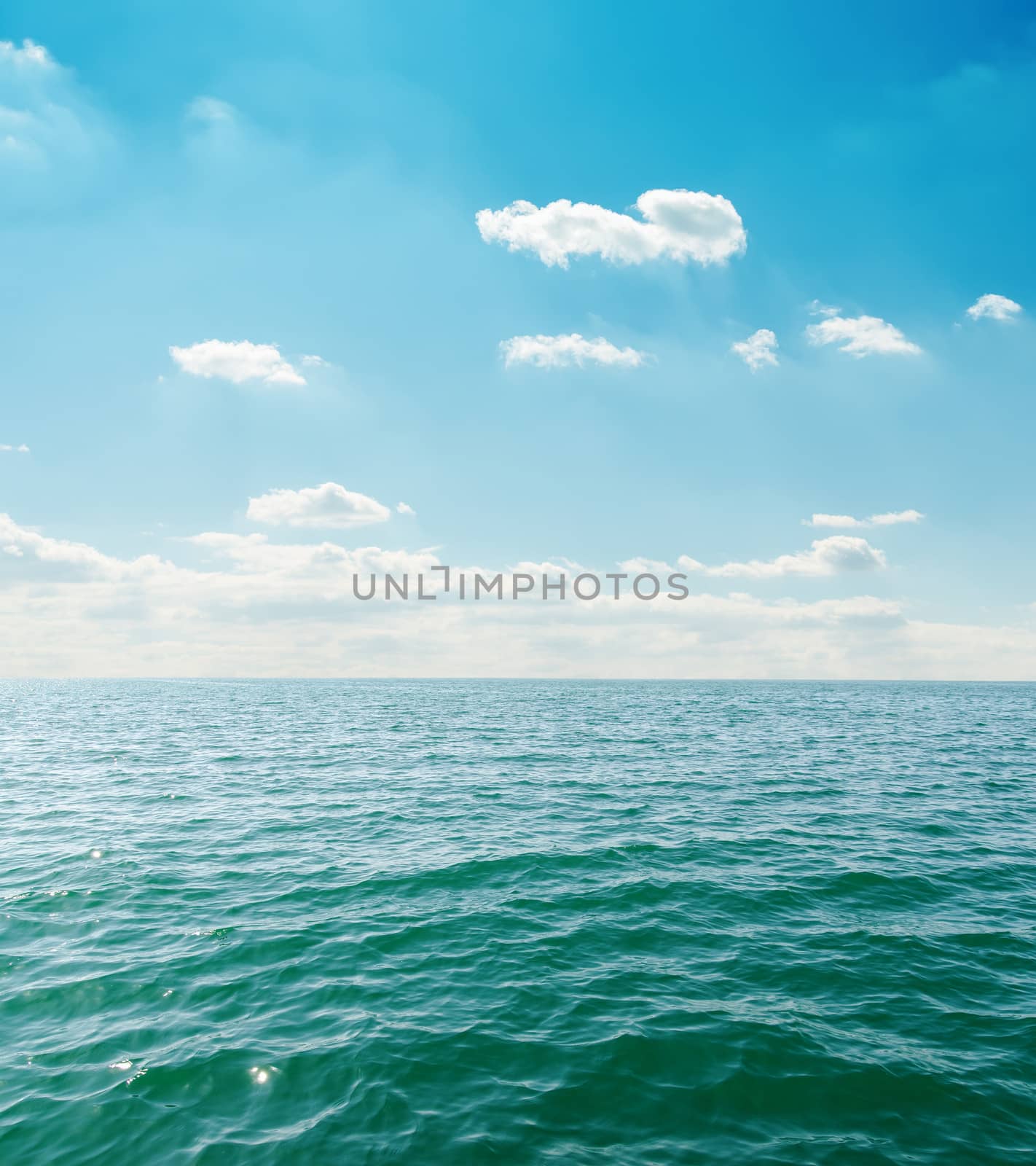 sea close up under clouds on sky