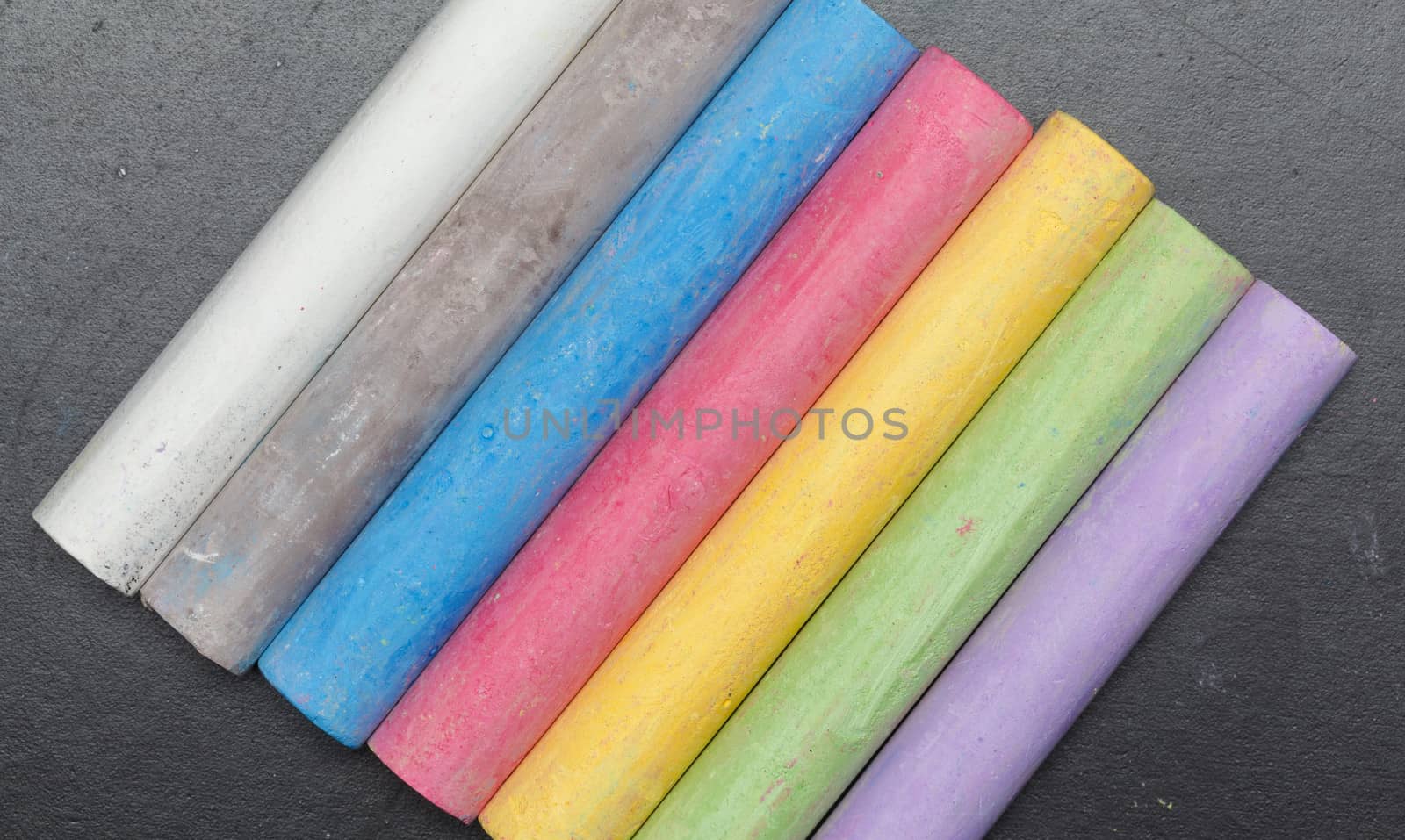 Sticks of chalk on a blackboard