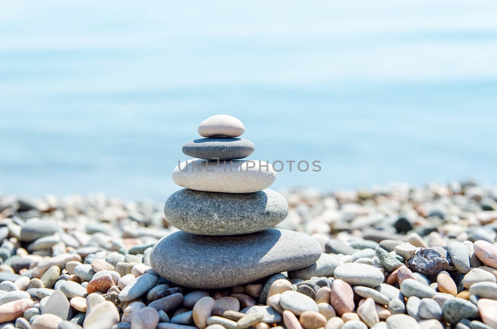 zen-like heap of stone near sea