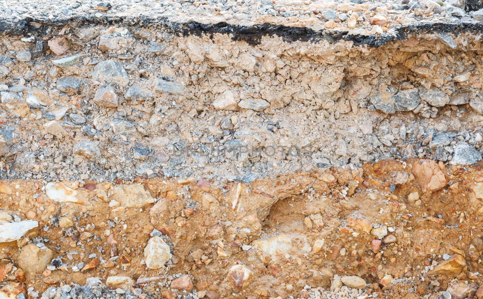 Layer of soil beneath the asphalt road