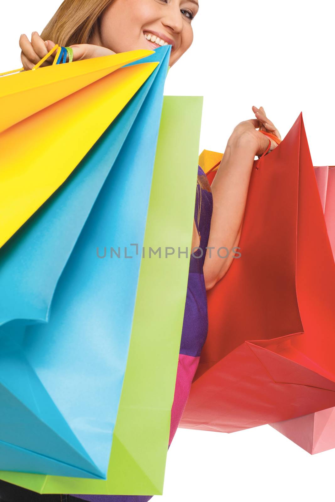 cropped smiling woman with shopping bags on white background