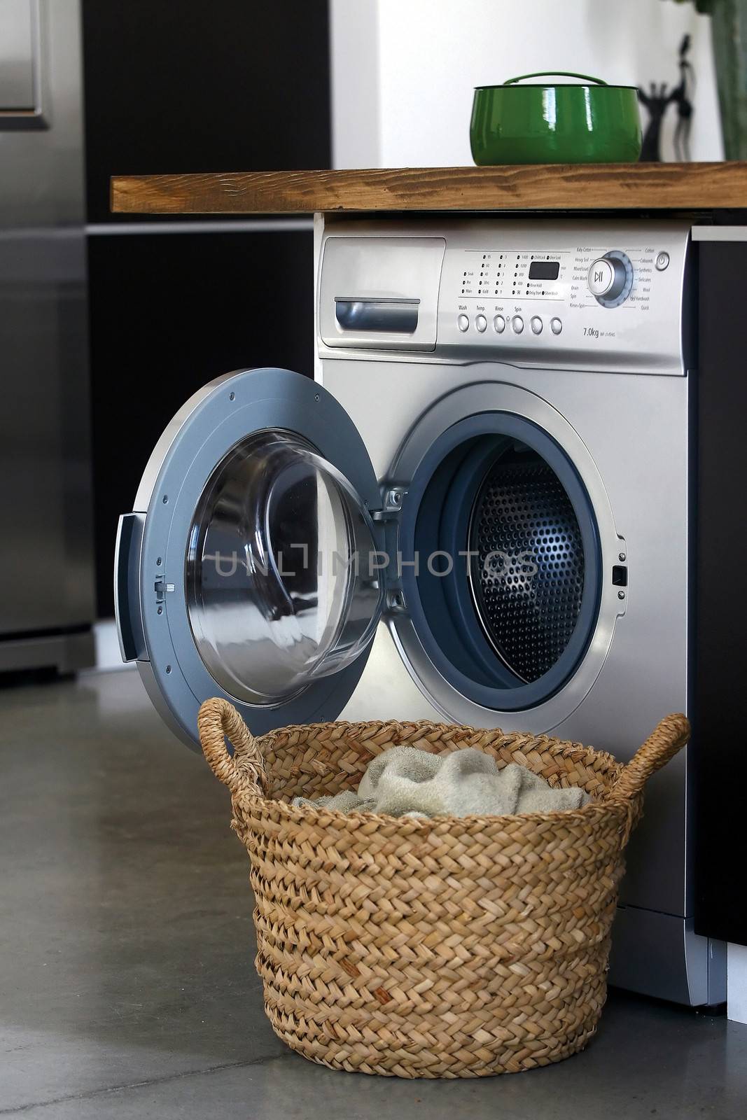 Interior of luxury laundry room with washing mashine