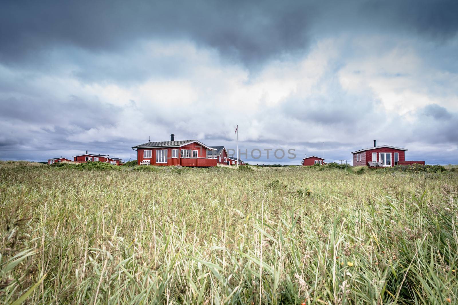 Scandinavian summer cabins in stormy weather