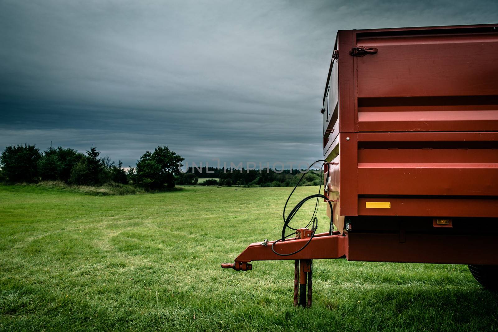 Industrial machine on grass and cloudy weather