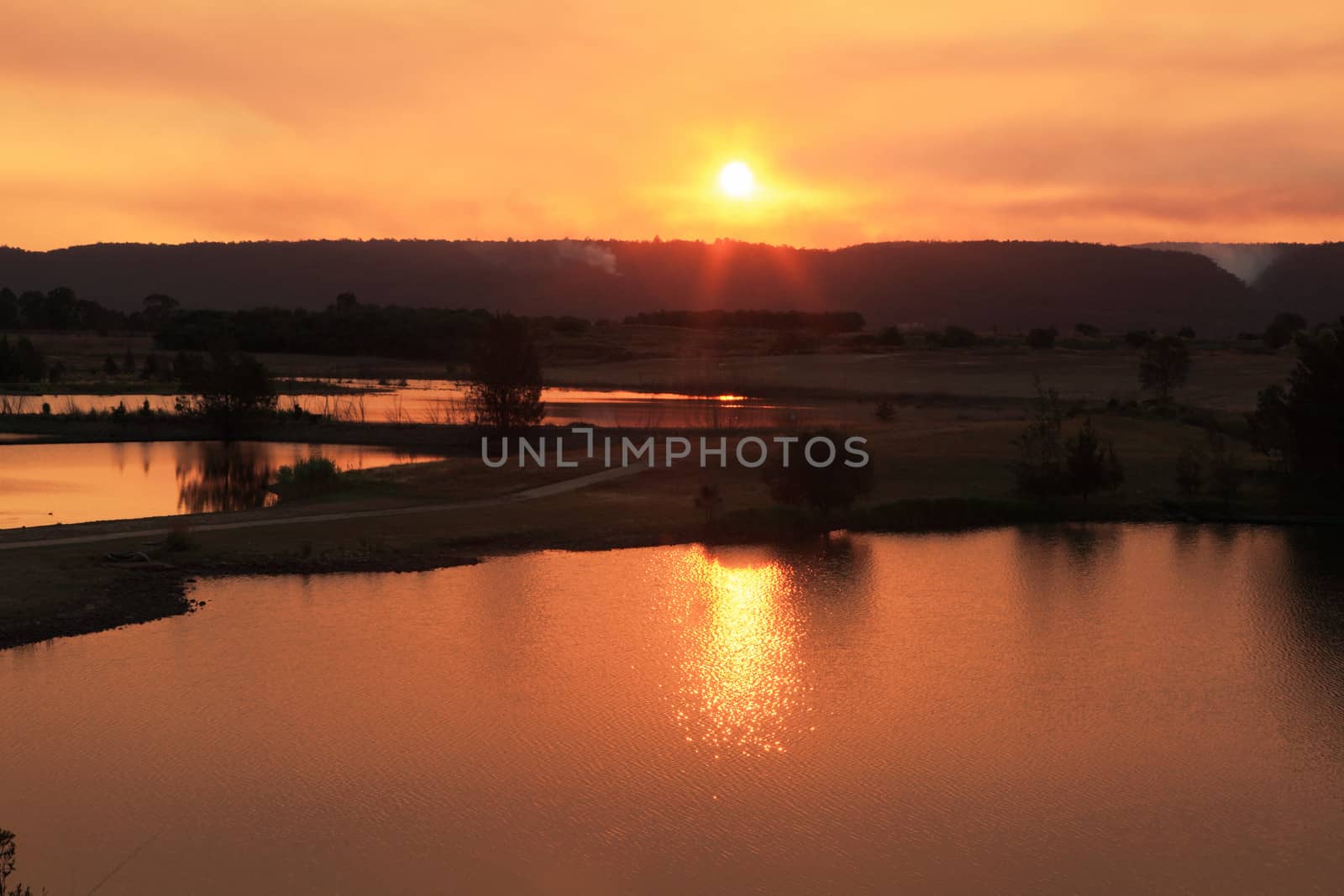 Setting sun over the Penrith Lakes, Australia, which is also the place for Sydney International Regatta Centre, Muru Mittigar Aboriginal Cultural Centre, and Penrith Whitewater Stadium