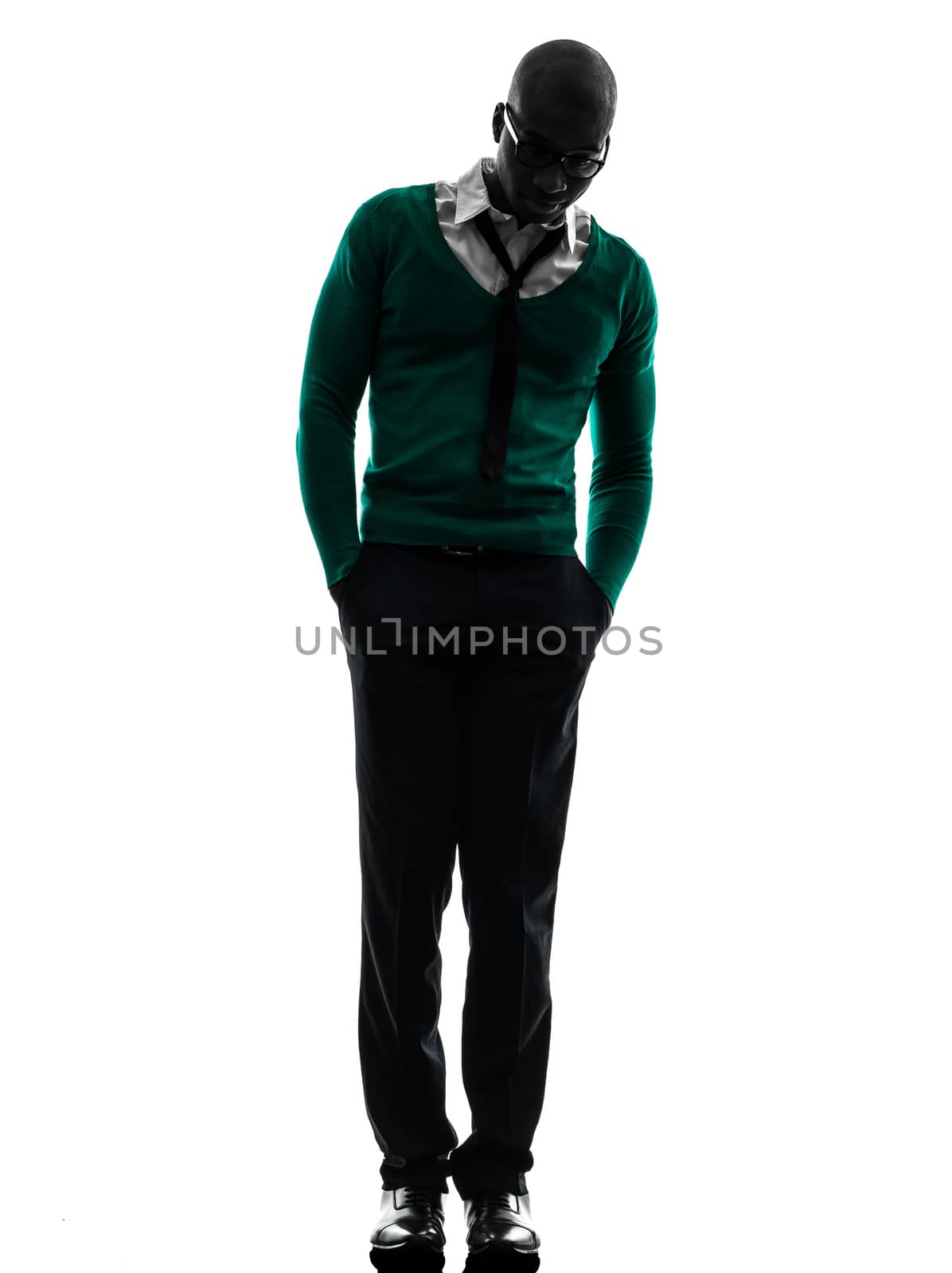 one african  black man walking in silhouette studio on white background