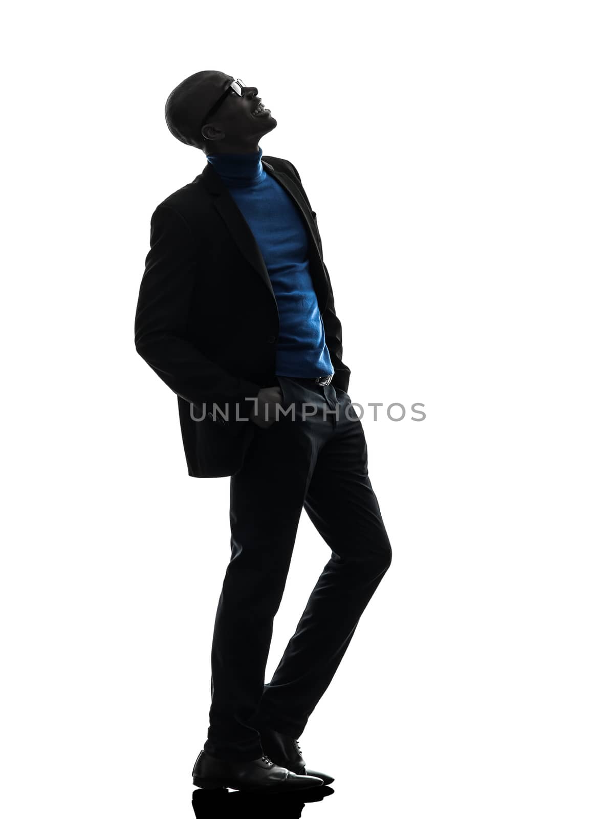 one african  black man standing looking up  smiling   in silhouette studio on white background