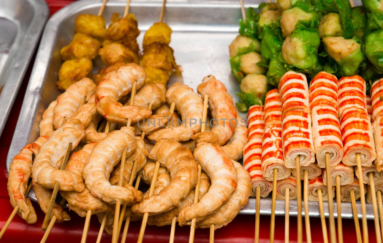 Asian snack with crab meat on a tray of outdoor street food counter