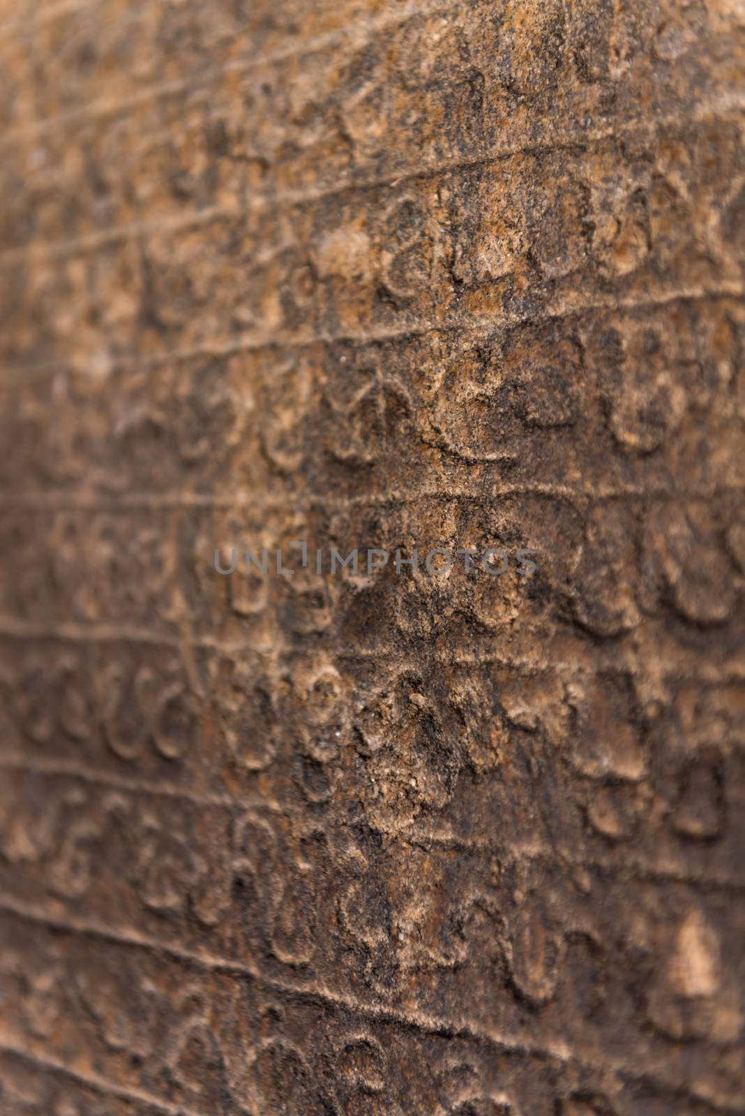 Ancient Sinhalese writing chiseled on stone by iryna_rasko