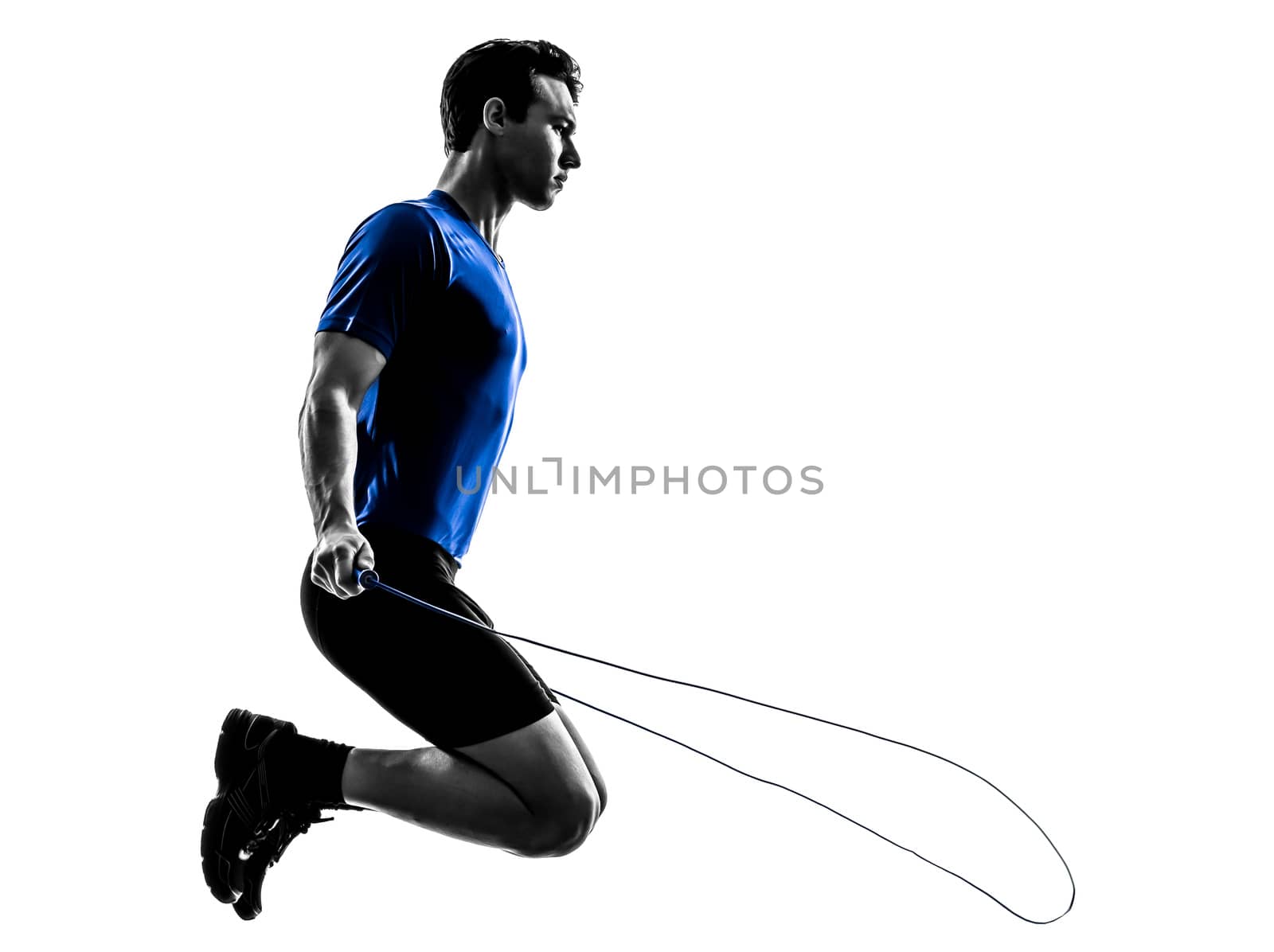 one caucasian man exercising jumping rope in silhouette studio  on white background