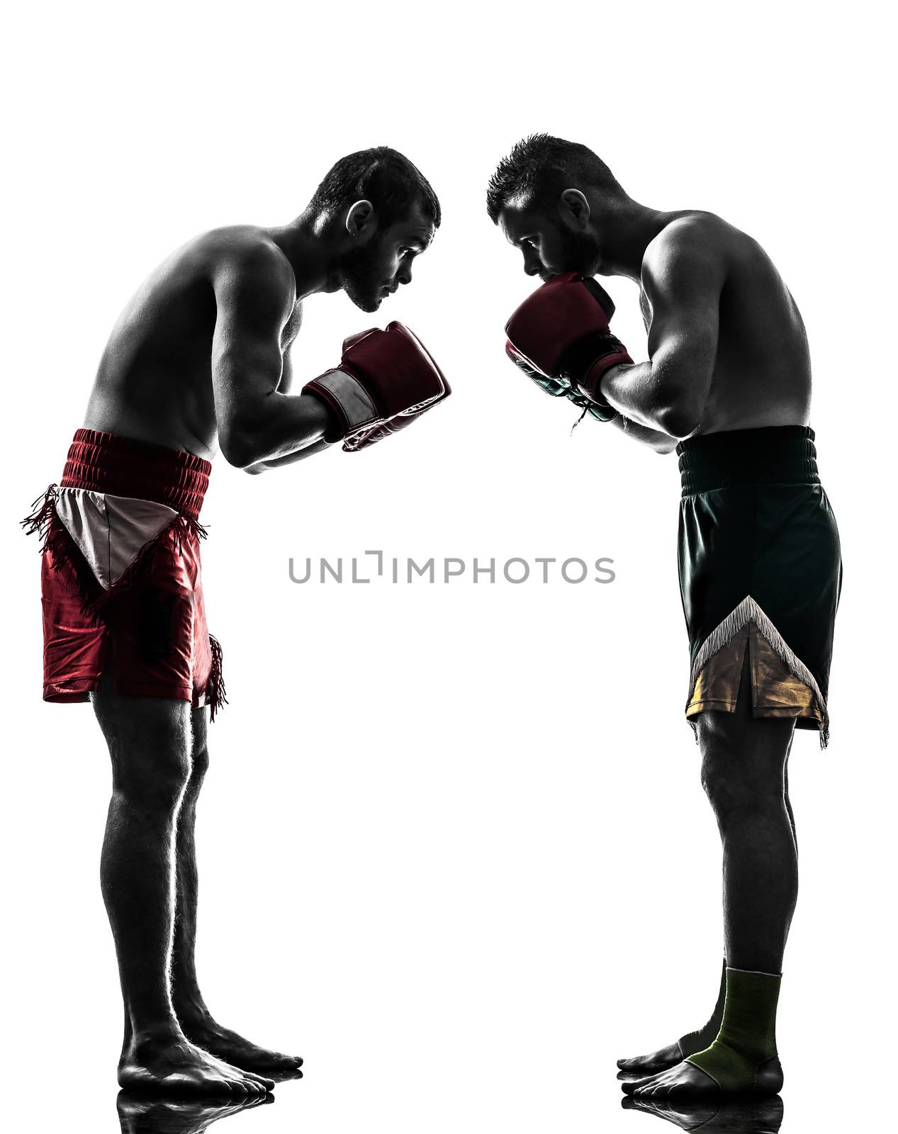 two men exercising thai boxing salute  silhouette by PIXSTILL