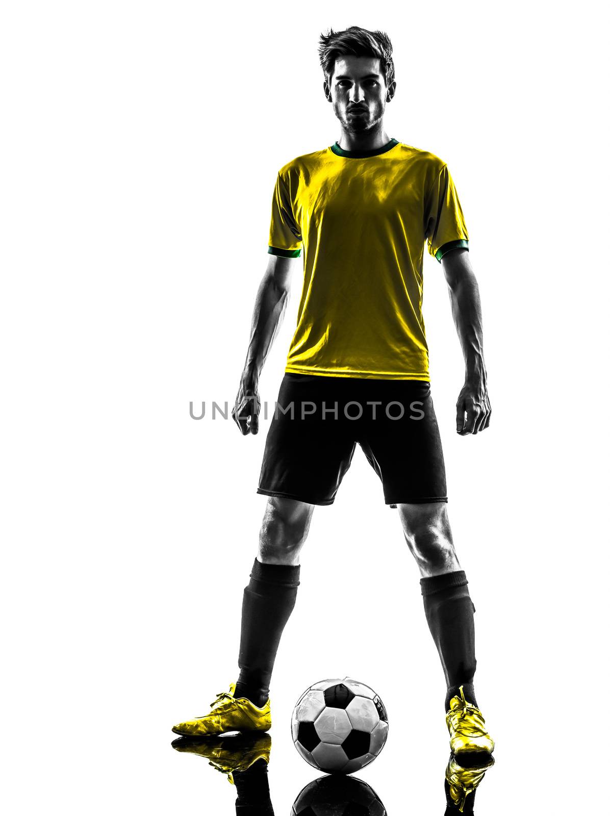 one brazilian soccer football player young man standing defiance  in silhouette studio  on white background