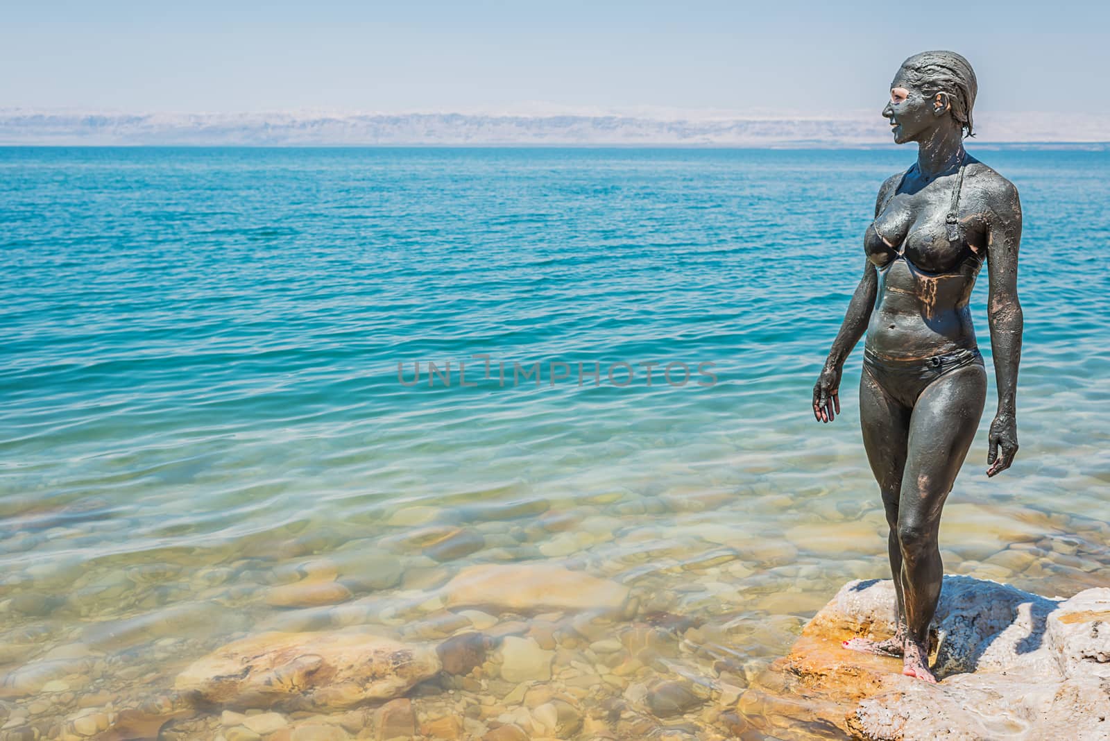 one caucasian woman with dead sea mud body care treatment in jordan