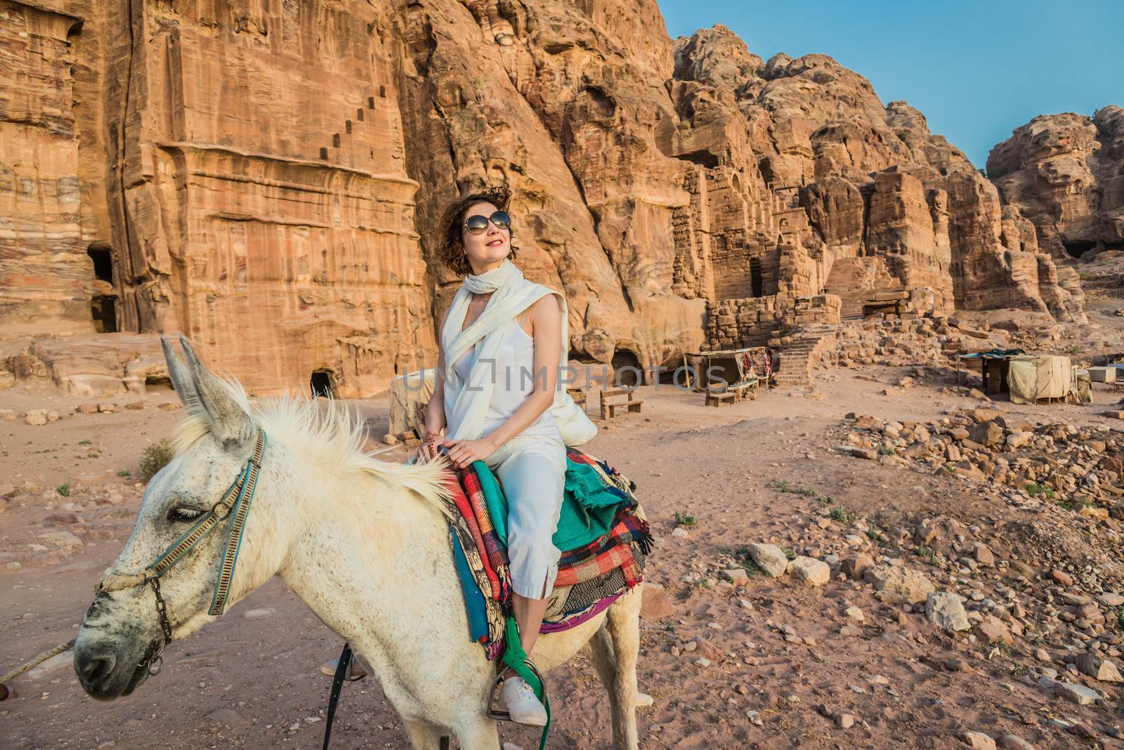 tourist riding donkey in nabatean petra jordan middle east