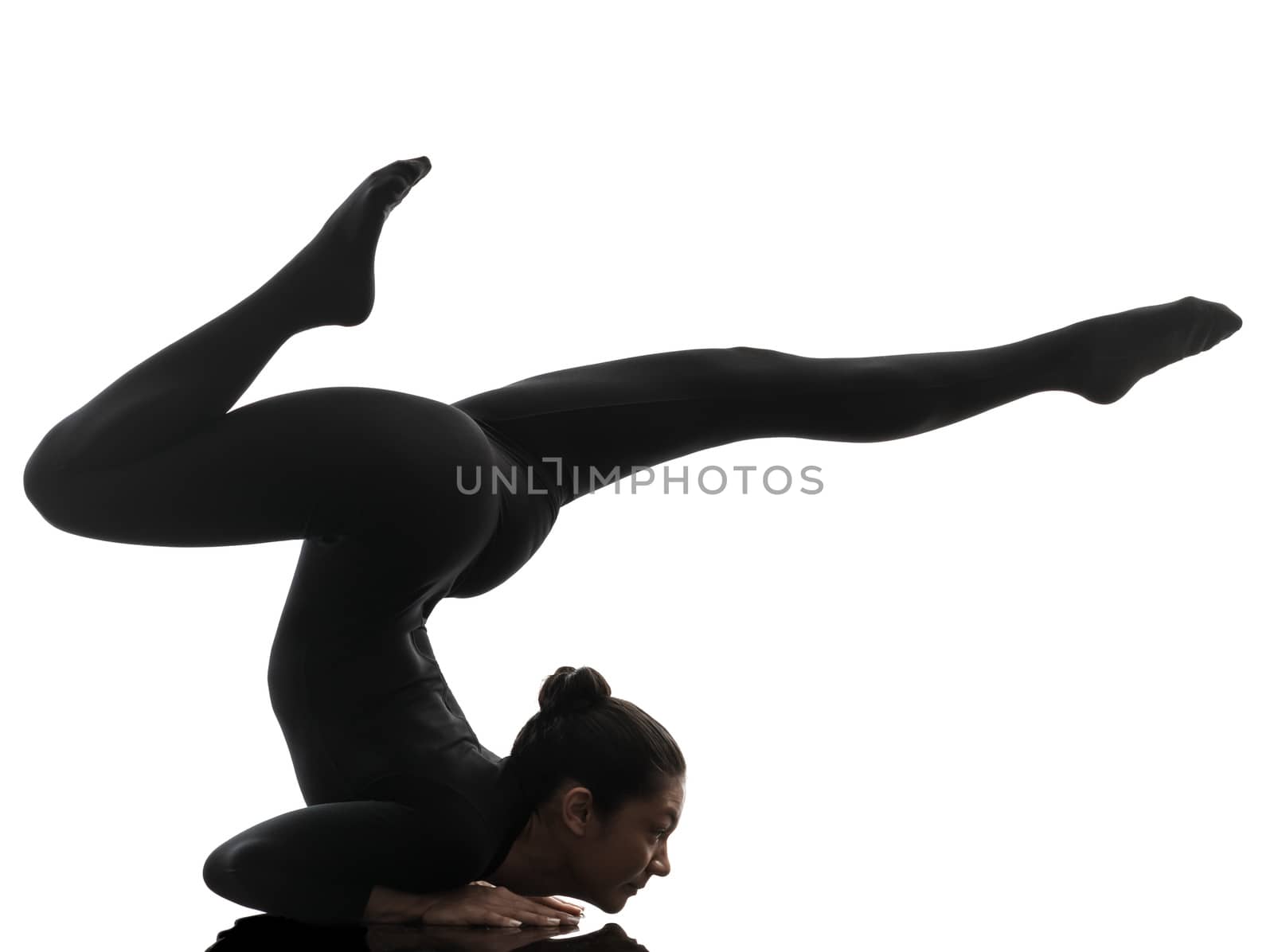 one caucasian woman contortionist practicing gymnastic yoga  in silhouette   on white background