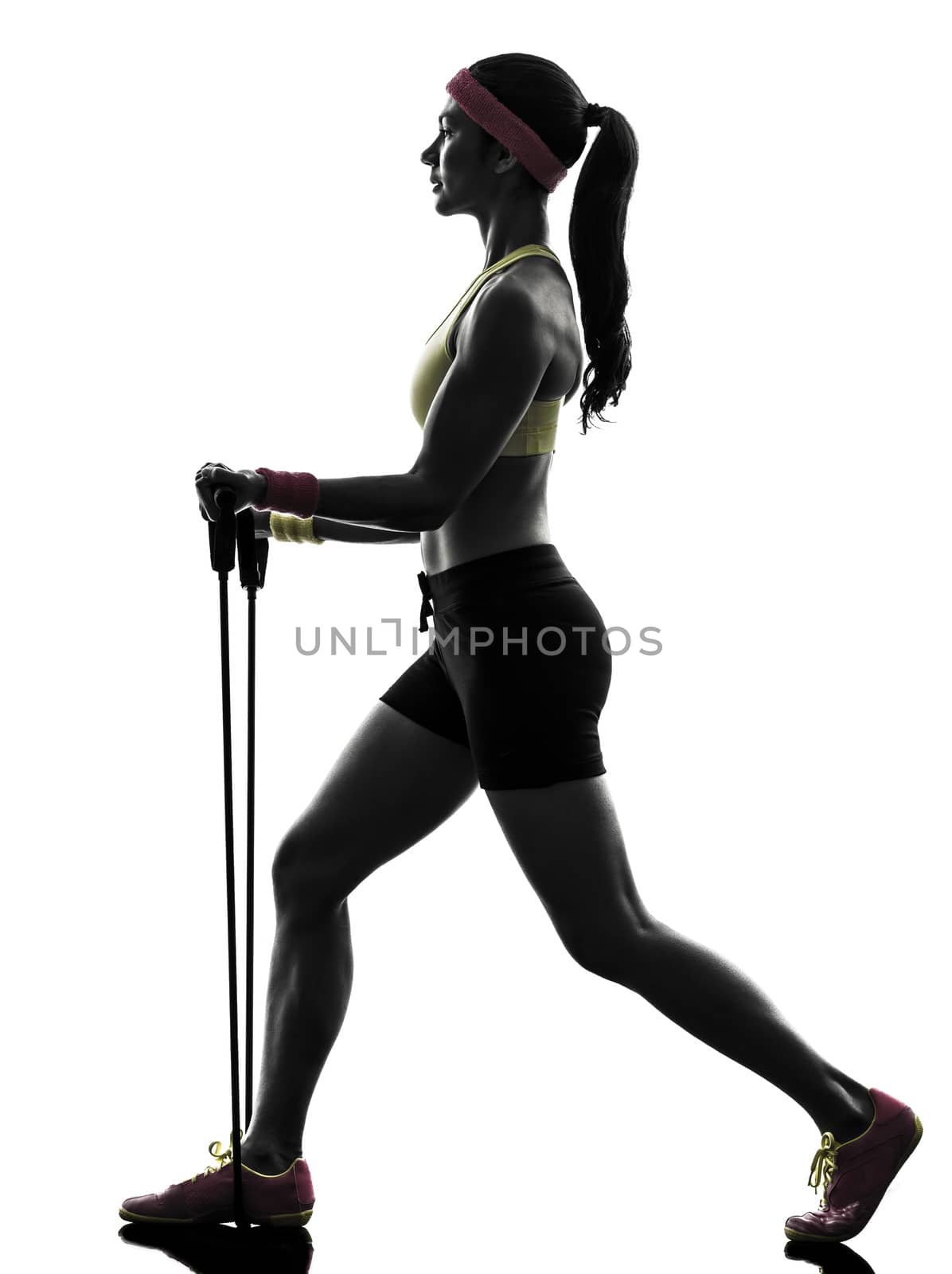 one  woman exercising fitness workout resistance bands in silhouette  on white background