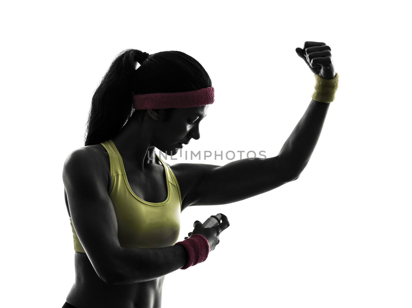 one woman applying deodorant exercising fitness workout in silhouette  on white background