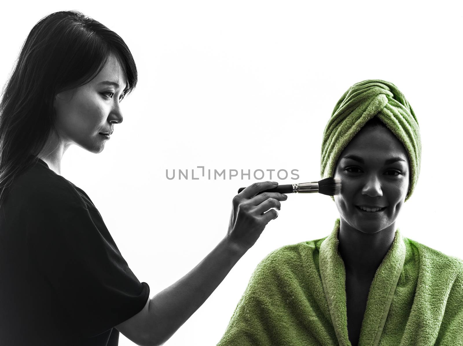 woman and make up artist   in silhouette  on white background