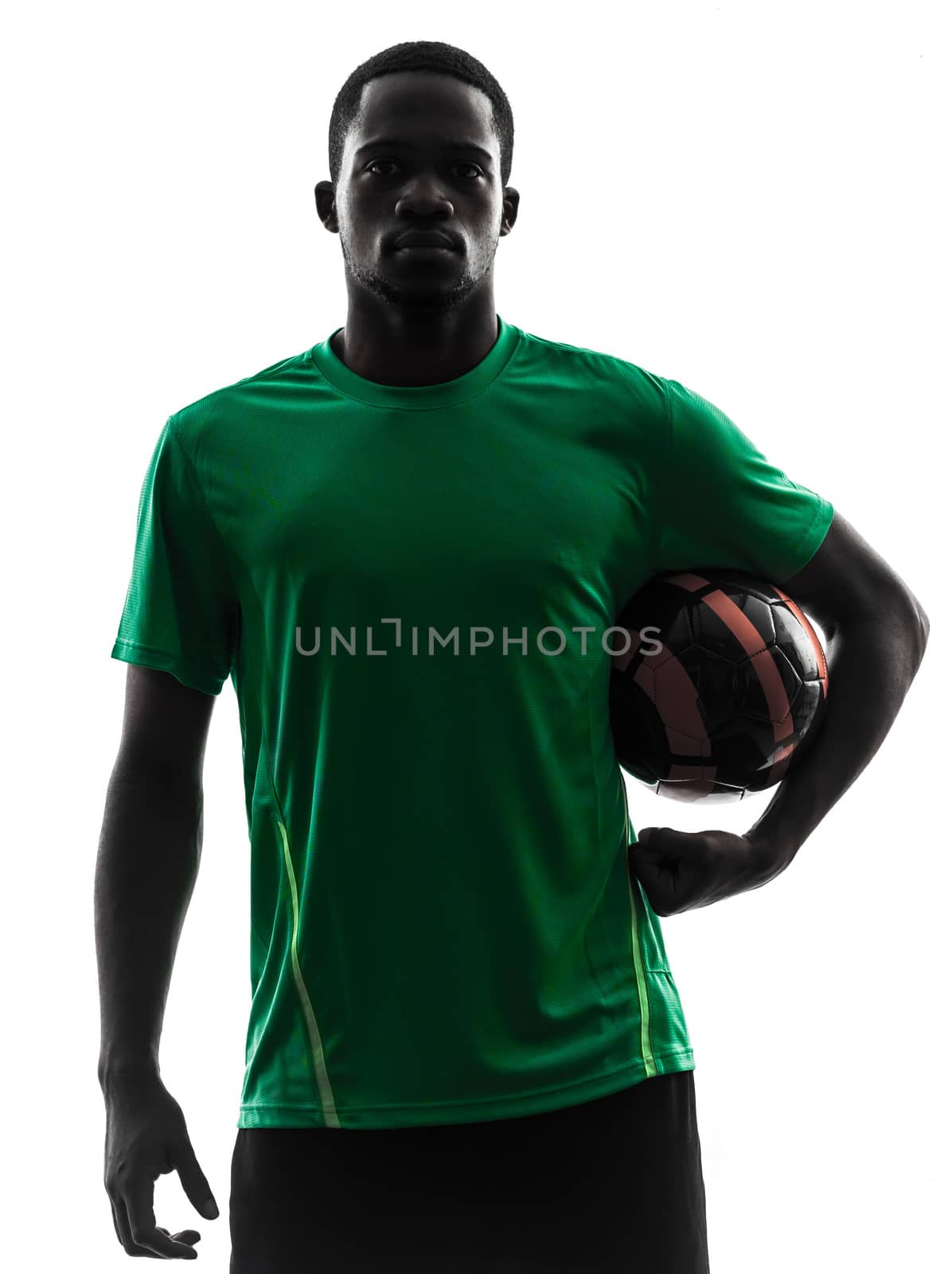 one african man soccer player green jersey holding football  in silhouette  on white background