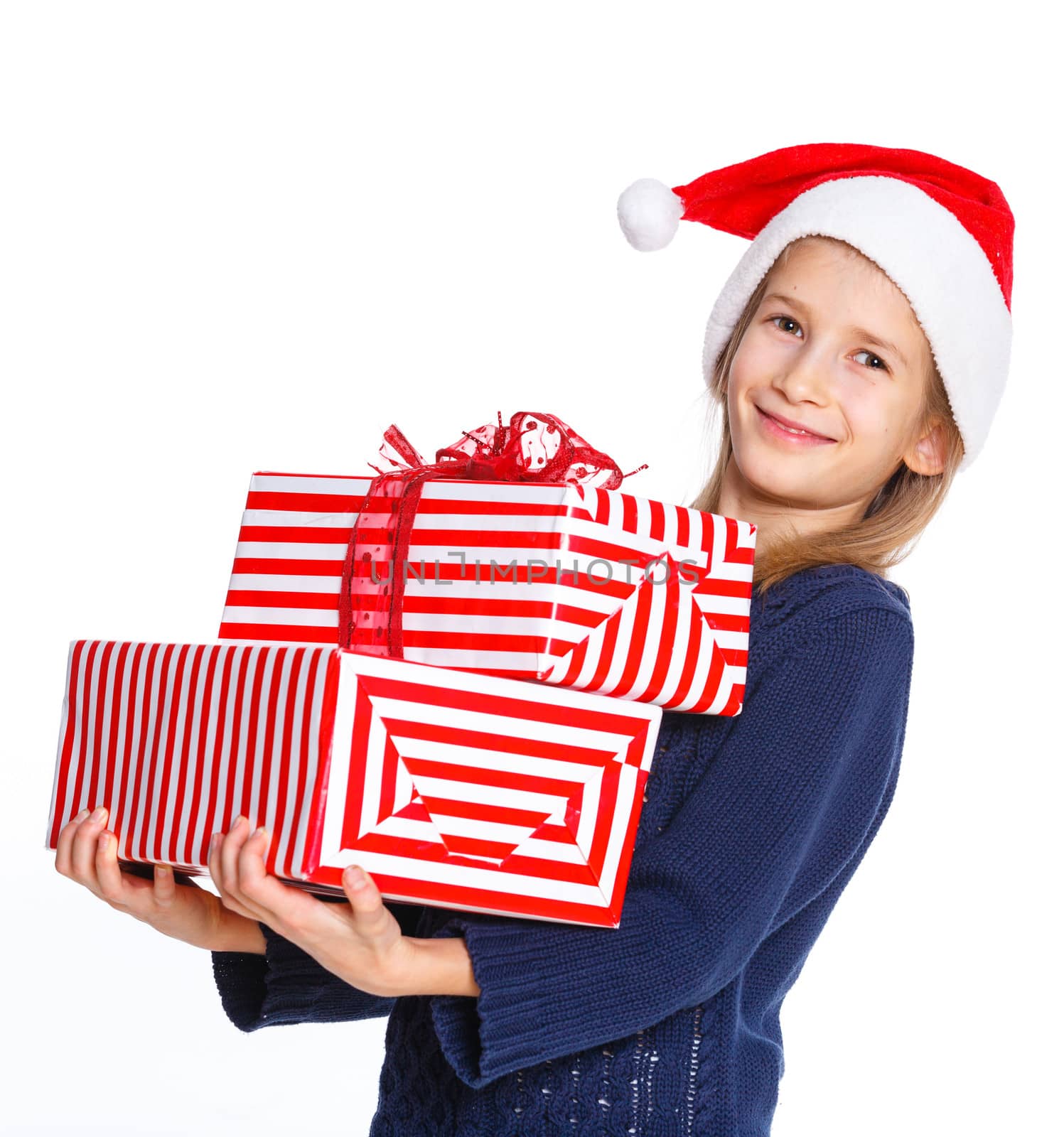 Christmas theme - Smiling cute girl in Santa's hat with gift box, isolated on white