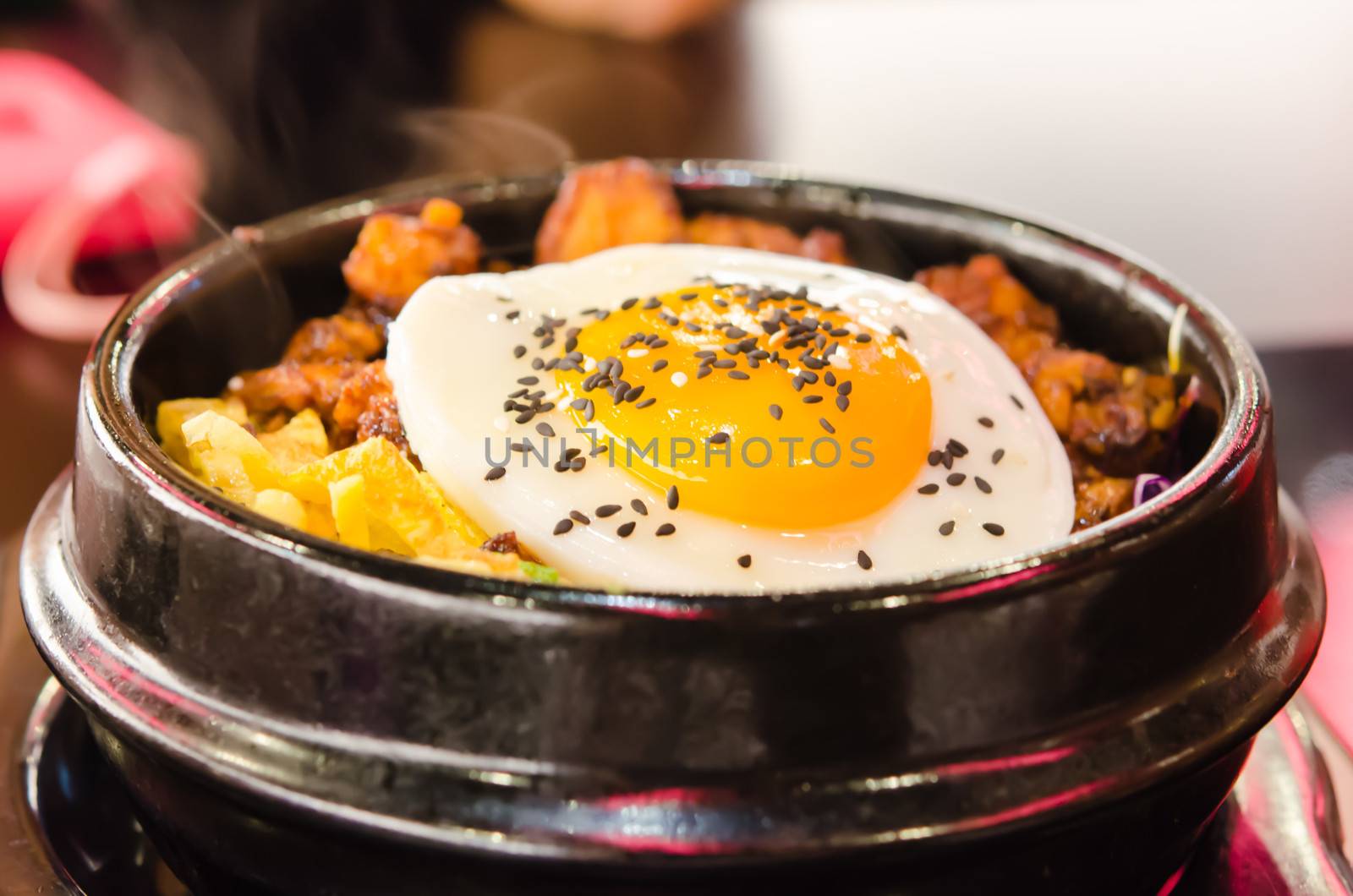 korean food  , bibimbap in a heated stone bowl ,  hot and delicious